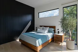 Large windows help bring natural light into the home, opening it up and making it feel less compartmentalized.