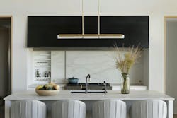 Adjacent to the great hall, this showpiece kitchen serves as an entertaining hub, concealing cooking tools behind sliding doors on either side of the range. Adjacent to the great hall, this showpiece kitchen serves as an entertaining hub, concealing cooking tools behind sliding doors on either side of the range.