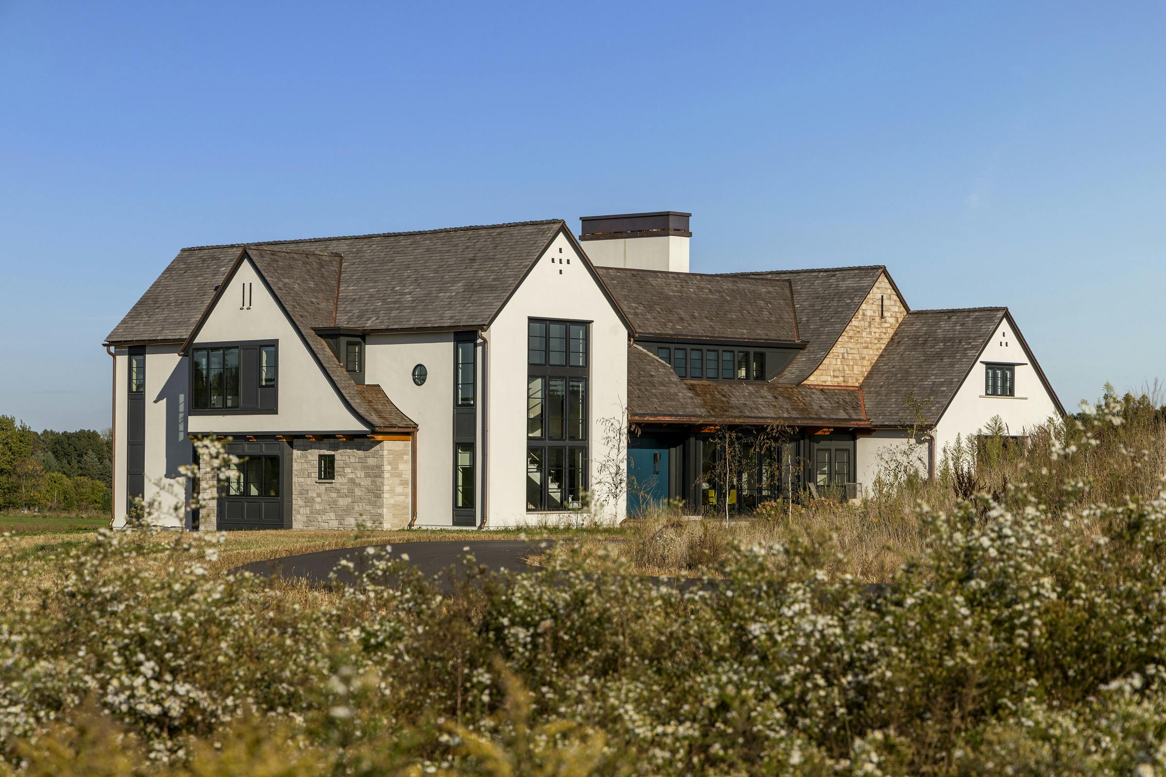 A low hill stands between the road and front door in this Stillwater, Mn. home.