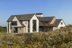 A low hill stands between the road and front door in this Stillwater, Mn. home. A low hill stands between the road and front door in this Stillwater, Mn. home.