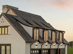 The white stucco provides a smooth backdrop for cedar shingles and copper gutters that add the texture and warmth. The white stucco provides a smooth backdrop for cedar shingles and copper gutters that add the texture and warmth.
