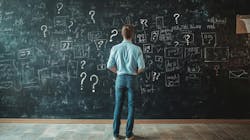 Man staring at blackboard Man staring at blackboard