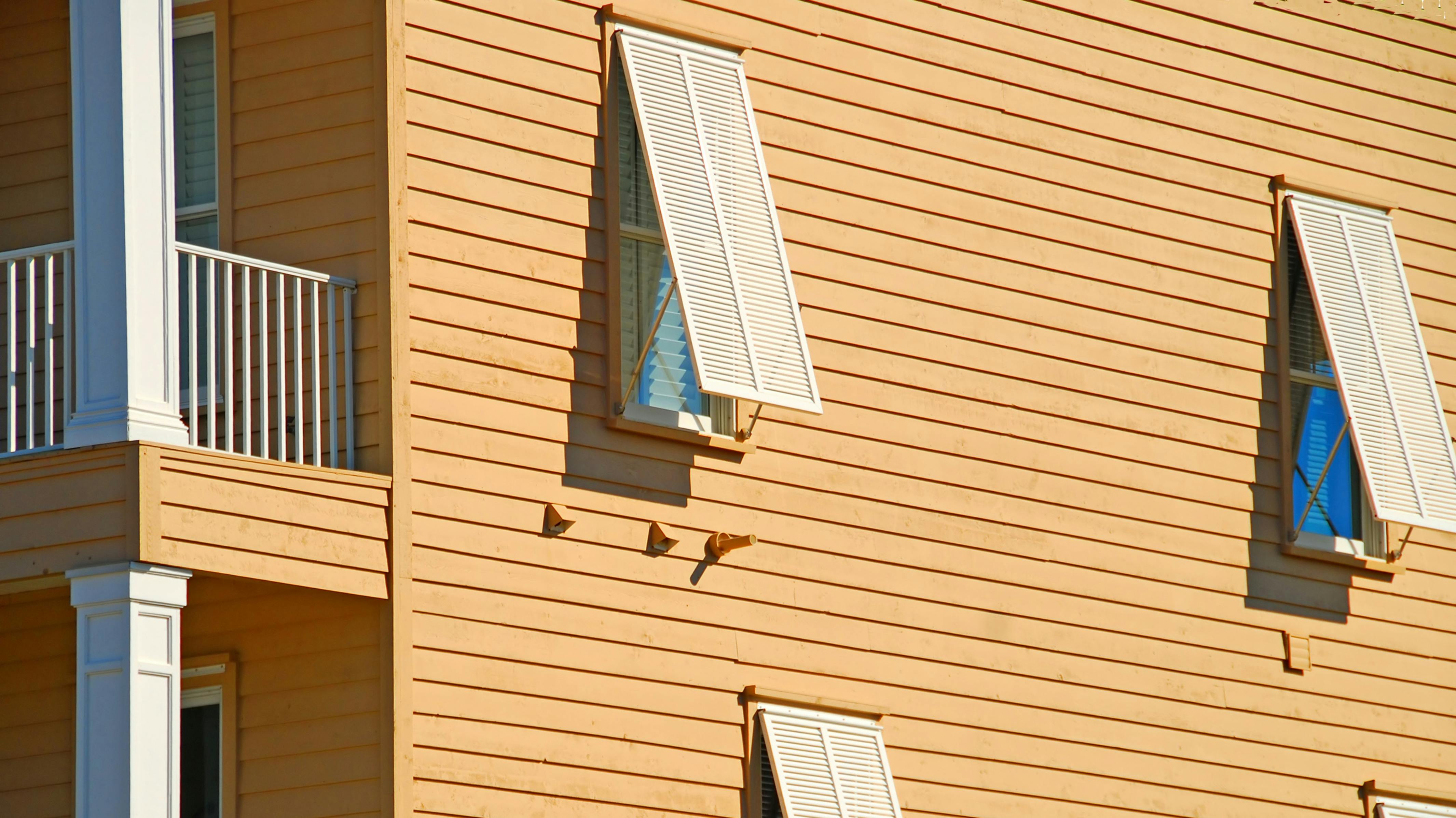 storm shutters on a coastal home