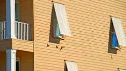 storm shutters on a coastal home storm shutters on a coastal home