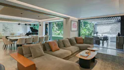 Interior of a great room with sliders connecting to the outdoors Interior of a great room with sliders connecting to the outdoors