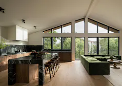 A large wall of windows extends the main living space while bringing in ample natural light. A large wall of windows extends the main living space while bringing in ample natural light.