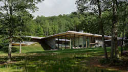 Home built by Gruver Cooley, sinking into the sloped site Home built by Gruver Cooley, sinking into the sloped site