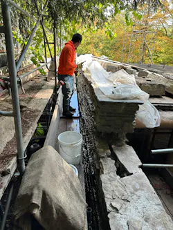 Crews working on the gaps in the east stone wall of the servants quarters. Crews working on the gaps in the east stone wall of the servants quarters.