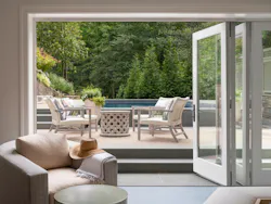 Bi-fold doors extend the guest suite into the pool terrace beyond. Bi-fold doors extend the guest suite into the pool terrace beyond.
