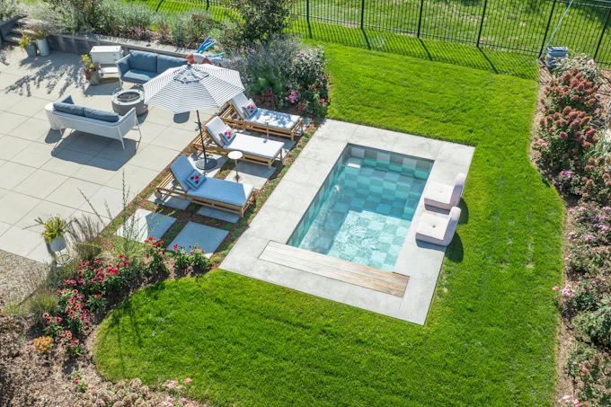 Aerial drone photo of a soake plunge pool in a Michigan back yard