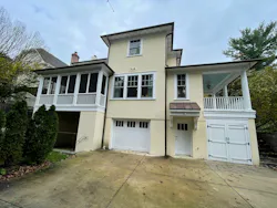 Prior to the renovation, the home featured a yellow exterior paint and an outdoor space that was mostly taken up by hardscaping. Prior to the renovation, the home featured a yellow exterior paint and an outdoor space that was mostly taken up by hardscaping.