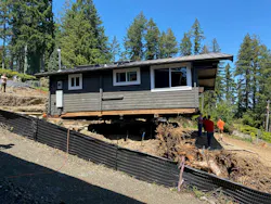 The original 600-square-foot cabin was moved to make way for the new home. It now serves as a guest house.