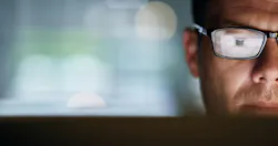Builder focused on a laptop
