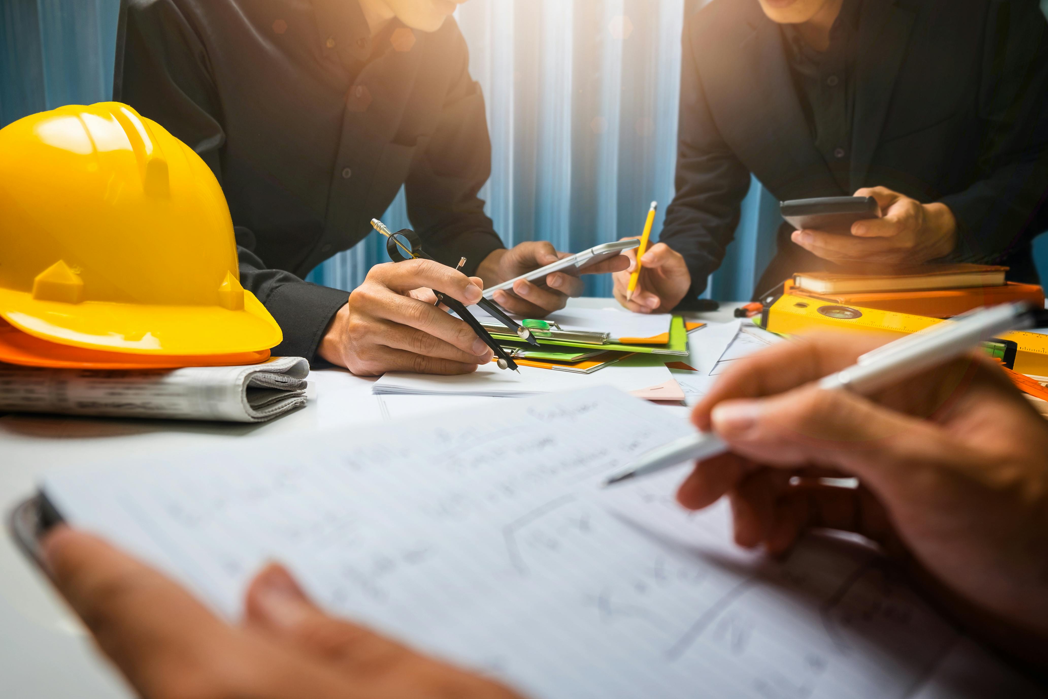 photo of collaboration around a construction set at a table