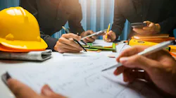 photo of collaboration around a construction set at a table