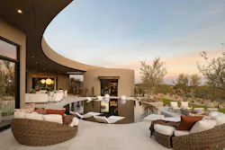Curved patio overhang by a pool
