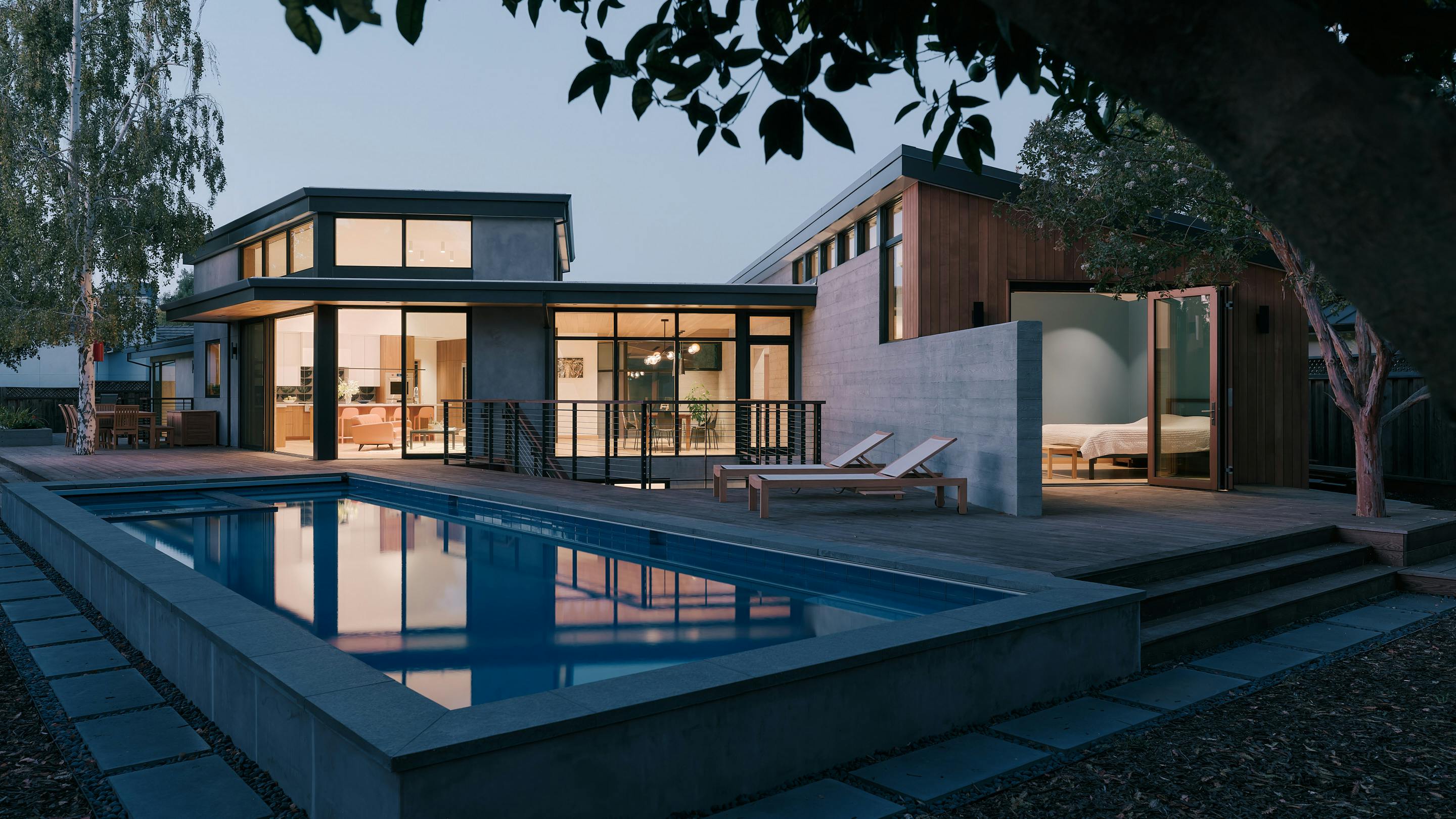 Rear elevation of a Los Altos Calif home showing a courtyard and pool