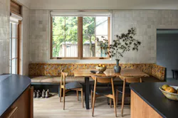 While the design team chose to forgo a mudroom, the elongated breakfast nook bench doubles as quick shoe storage.